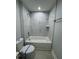 Elegant bathroom showcases marble-tiled shower, a tub, and modern fixtures at 6 Bahia Course Ln, Ocala, FL 34472
