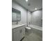 Newly renovated bathroom features a vanity, toilet, and white marble tiled tub-shower combo at 6 Bahia Course Ln, Ocala, FL 34472