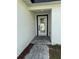 Close-up of the front door featuring a glass window with a black frame at 6 Bahia Course Ln, Ocala, FL 34472