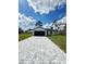 Inviting single-story home with a spacious driveway, two-car garage, and green grass at 6 Bahia Course Ln, Ocala, FL 34472