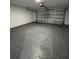 Clean, spacious garage with speckled floor coating for a modern look at 6 Bahia Course Ln, Ocala, FL 34472