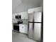Bright kitchen featuring modern stainless steel appliances and white cabinets at 6 Bahia Course Ln, Ocala, FL 34472