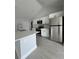 Modern kitchen with stainless steel appliances and a kitchen island at 6 Bahia Course Ln, Ocala, FL 34472