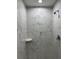 Modern shower featuring white marble tiling and rainfall shower head at 6 Bahia Course Ln, Ocala, FL 34472