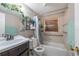 Bathroom with a tub, shower, and vanity, offering functionality at 615 N Emory Ave, Kissimmee, FL 34741