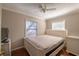 Bright bedroom featuring wood flooring, neutral walls, and window at 615 N Emory Ave, Kissimmee, FL 34741