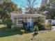 Charming single-story home with well-manicured landscaping, a welcoming front porch, and a cozy curb appeal at 615 N Emory Ave, Kissimmee, FL 34741