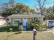 Charming single-story home with a well-manicured lawn and inviting front porch at 615 N Emory Ave, Kissimmee, FL 34741