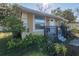 Charming home featuring a well-kept lawn, cozy porch, and welcoming entrance at 615 N Emory Ave, Kissimmee, FL 34741