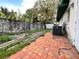Backyard with a brick patio and some foliage at 616 N Palm Ave, Kissimmee, FL 34741