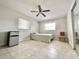 Bedroom with tiled floor, ceiling fan, and natural light at 616 N Palm Ave, Kissimmee, FL 34741