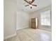 A cozy bedroom with natural light and ample space for a dresser at 616 N Palm Ave, Kissimmee, FL 34741