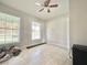 Bedroom with natural light from two windows and neutral-colored tile flooring at 616 N Palm Ave, Kissimmee, FL 34741