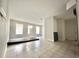 Open-concept living room with tiled floors and an abundance of natural light at 616 N Palm Ave, Kissimmee, FL 34741