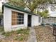 Exterior view of a shed with boarded windows at 616 N Palm Ave, Kissimmee, FL 34741