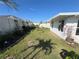Spacious fenced backyard with lush lawn, creating a private and inviting outdoor space for relaxation and entertainment at 676 Tanaro Ln, Haines City, FL 33844