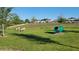 Outdoor dog park featuring play equipment and green grass in a fenced area at 676 Tanaro Ln, Haines City, FL 33844
