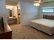 Cozy bedroom featuring a queen-sized bed, vanity, and natural lighting at 706 Francis St, Kissimmee, FL 34741