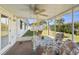 Relaxing screened lanai with table and chairs, ideal for outdoor dining and entertainment at 706 Francis St, Kissimmee, FL 34741