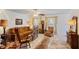 Cozy living room with a vintage style grandfather clock and carpet flooring at 706 Francis St, Kissimmee, FL 34741