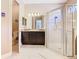 Bathroom with a vanity, granite countertop, and glass enclosed shower at 741 Villa Park Rd, Poinciana, FL 34759