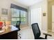 Bright office space featuring a large window, two desks, and neutral paint at 741 Villa Park Rd, Poinciana, FL 34759