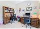 Spacious home office featuring dual workstations, built-in shelving, and ample workspace at 741 Villa Park Rd, Poinciana, FL 34759