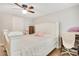 Bedroom with a ceiling fan and decorative headboard at 78 N 5Th St, Orlando, FL 32833