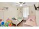 Bedroom with twin beds, wood floors, and a ceiling fan at 78 N 5Th St, Orlando, FL 32833