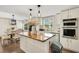 Bright kitchen features a large island with wood countertop, modern appliances and cabinetry at 78 N 5Th St, Orlando, FL 32833