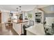 Bright kitchen features a large island with wood countertop, modern appliances and cabinetry at 78 N 5Th St, Orlando, FL 32833