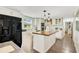 Bright kitchen features a large island with wood countertop, modern appliances and cabinetry at 78 N 5Th St, Orlando, FL 32833