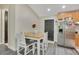 Eat-in kitchen featuring stainless steel appliances, light gray floors and white accents at 78 N 5Th St, Orlando, FL 32833