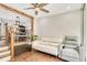 Living room featuring wood floors, ceiling fan, staircase, and view into the dining area at 78 N 5Th St, Orlando, FL 32833