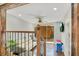 Bright living room with wood floors, ceiling fan, and sliding door access to the outdoors at 78 N 5Th St, Orlando, FL 32833