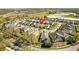Panoramic aerial shot of a residential neighborhood, surrounded by lush greenery and ponds at 8063 King Palm Cir, Kissimmee, FL 34747