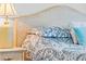 Close up of the Primary bedroom wicker headboard and lamp at 8063 King Palm Cir, Kissimmee, FL 34747