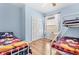 bedroom with twin beds, bunk beds, and a window at 8063 King Palm Cir, Kissimmee, FL 34747