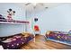 Cheerful bedroom featuring a bunk bed, twin bed, and fun Mickey Mouse-themed decor at 8063 King Palm Cir, Kissimmee, FL 34747