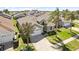 Aerial view of a well-maintained home with lush landscaping and a two-car garage at 8063 King Palm Cir, Kissimmee, FL 34747