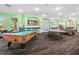A game room featuring a pool table, ping pong table, arcade games, and fun decorations at 8063 King Palm Cir, Kissimmee, FL 34747