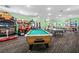 A large game room with arcade games, a pool table, and a ping pong table at 8063 King Palm Cir, Kissimmee, FL 34747