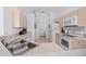 Well-lit kitchen with white appliances, laminate countertops, and easy access to the laundry area at 8063 King Palm Cir, Kissimmee, FL 34747