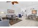Open-concept living space with modern furnishings, tile flooring, and dining area at 8063 King Palm Cir, Kissimmee, FL 34747