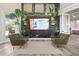 A well-decorated lobby space with comfortable chairs and an informational screen at 8063 King Palm Cir, Kissimmee, FL 34747
