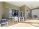 Covered patio with neutral colors, ceiling fans, and outdoor furniture, perfect for entertaining at 8063 King Palm Cir, Kissimmee, FL 34747