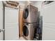 Efficient laundry area showcasing a stacked washer and dryer unit, maximizing space and convenience at 817 Bocavista Ct, Davenport, FL 33896