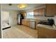 Functional kitchen with stainless steel appliances, ample cabinet space, and tile flooring at 8212 Le Mesa St, Orlando, FL 32827
