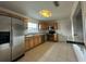 Efficient kitchen featuring stainless steel appliances, granite countertops, and tile flooring at 8212 Le Mesa St, Orlando, FL 32827