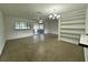 Bright living room boasting natural light, ceiling fan, and built-in shelving for storage at 8212 Le Mesa St, Orlando, FL 32827